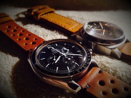 Two Omega watches with brown leather straps